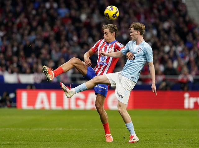 Soccer Football - LaLiga - Atletico Madrid v Celta Vigo - Metropolitano, Madrid, Spain - February 15, 2025 Atletico Madrid's Marcos Llorente in action with Celta Vigo's Williot Swedberg REUTERS/Ana Beltran
