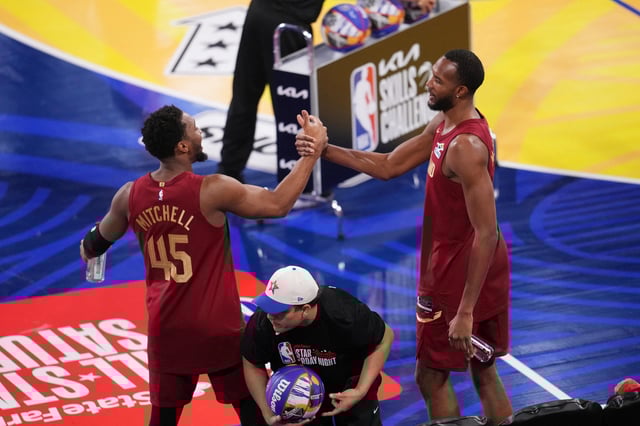 Feb 15, 2025; San Francisco, CA, USA; Team Cavs guard Donovan Mitchell (45) and center Evan Mobley (4) of the Cleveland Cavaliers celebrate after winning the skills challenge during All Star Saturday Night ahead of the 2025 NBA All Star Game at Chase Center. Mandatory Credit: Cary Edmondson-Imagn Images