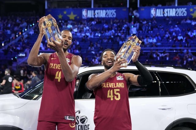 Feb 15, 2025; San Francisco, CA, USA; Team Cavs center Evan Mobley (4) and guard Donovan Mitchell (45) of the Cleveland Cavaliers celebrate with the trophies after winning the skills challenge during All Star Saturday Night ahead of the 2025 NBA All Star Game at Chase Center. Mandatory Credit: Kyle Terada-Imagn Images