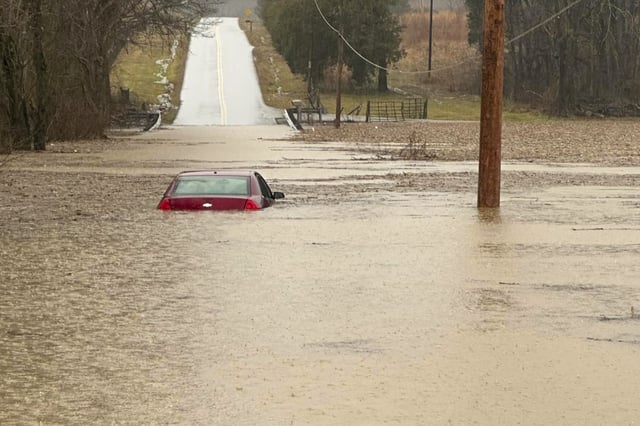 This photo provided by the Warren County Sheriff&#39;s Office shows a partially submerged car outside of Bowling Green, Kentucky, on Saturday, Feb. 15, 2025.