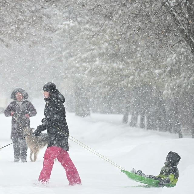 People walk through a city park during a snowstorm in Montreal, Thursday, Feb. 13, 2025. THE CANADIAN PRESS/Graham Hughes