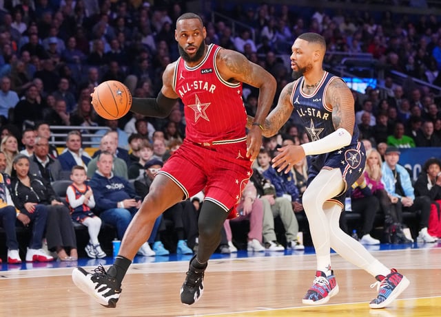 Western Conference forward LeBron James (23) of the Los Angeles Lakers dribbles the ball against Eastern Conference guard Damian Lillard (0) during the first half of the 73rd NBA All Star game at Gainbridge Fieldhouse in Indianapolis, Indiana on Feb. 18, 2024.