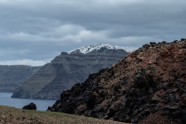 A view of the island of Santorini (back) as seen from the volcanic island of Nea Kameni, Greece, February 10, 2025. REUTERS/Max Gyselinck/File Photo
