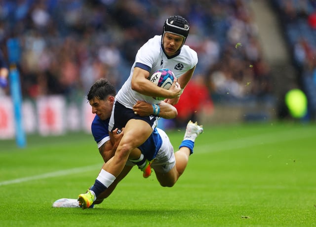 Rugby Union - Rugby World Cup 2023 warm up - Scotland v Italy - Murrayfield Stadium, Edinburgh, Scotland, Britain - July 29, 2023 Scotland's Darcy Graham in action with Italy's Tommaso Menoncello Action Images via Reuters/Lee Smith/File Photo