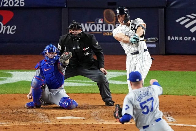 Yankees designated hitter Giancarlo Stanton connects for a solo home run off Dodgers pitcher Ryan Brasier in Game 4 of the 2024 World Series.