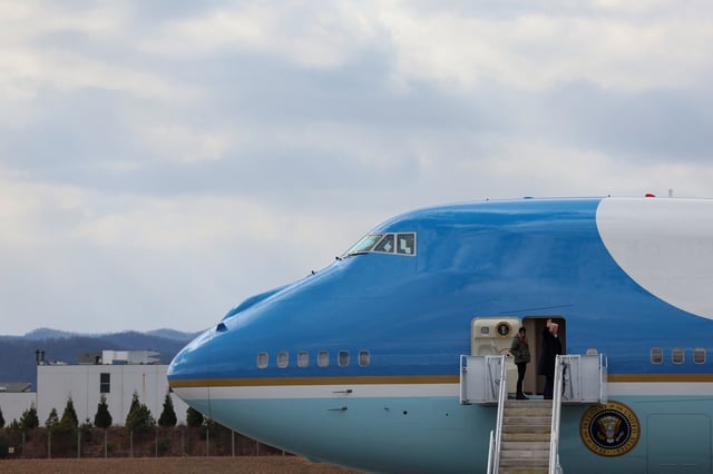 U.S. President Donald Trump and first lady Melania Trump board Air Force One as they depart for California, at Asheville Regional Airport in Asheville, North Carolina, U.S., January 24, 2025. REUTERS/Leah Millis/File Photo