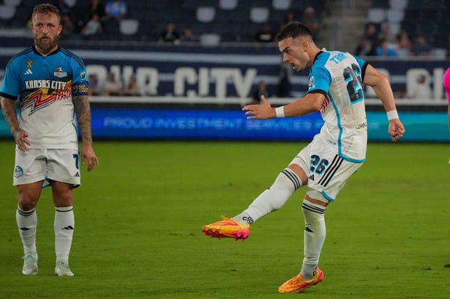 Sporting Kansas City midfielder Erik Thommy (26) takes a shot on goal during an MLS game against Minnesota United on Sept. 21, 2024.