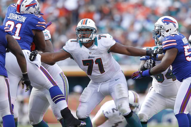 MIAMI GARDENS, FL - DECEMBER 23: Jonathan Martin #71 of the Miami Dolphins defends along the line against the Buffalo Bills on December 23, 2012 at Sun Life Stadium in Miami Gardens, Florida.
