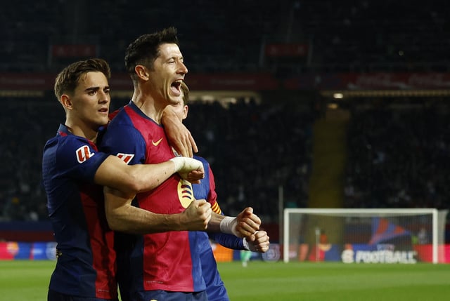 Soccer Football - LaLiga - FC Barcelona v Rayo Vallecano - Estadi Olimpic Lluis Companys, Barcelona, Spain - February 17, 2025 FC Barcelona's Robert Lewandowski celebrates scoring their first goal with FC Barcelona's Gavi REUTERS/Albert Gea