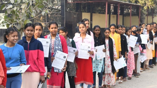 BSEB Bihar Matric Exam 2025: Students stand in queue before appearing in the Class 10th exam of the Bihar School Examination Board (BSEB) at Dhaneshwari Devanand Balika High School Danapur in Patna.  