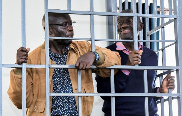 Opposition leader Kizza Besigye and Obeid Lutale stand in a steel dock at the Uganda Military General Court Martial in Makindye, a suburb of Kampala, Uganda December 2, 2024. REUTERS Abubaker Lubowa/File Photo