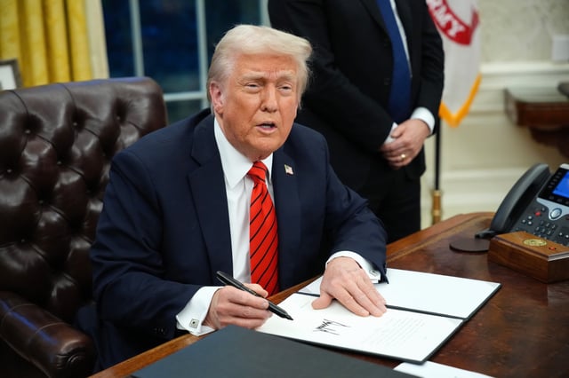 President Donald Trump signs a series of executive orders in the Oval Office at the White House on February 10, 2025 in Washington, DC.