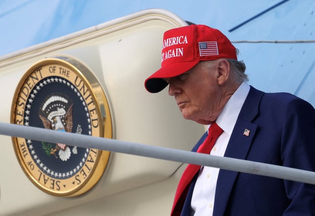 U.S. President Donald Trump steps from Air Force One upon arrival in West Palm Beach, Florida, U.S., February 16, 2025. REUTERS/Kevin Lamarque/File Photo