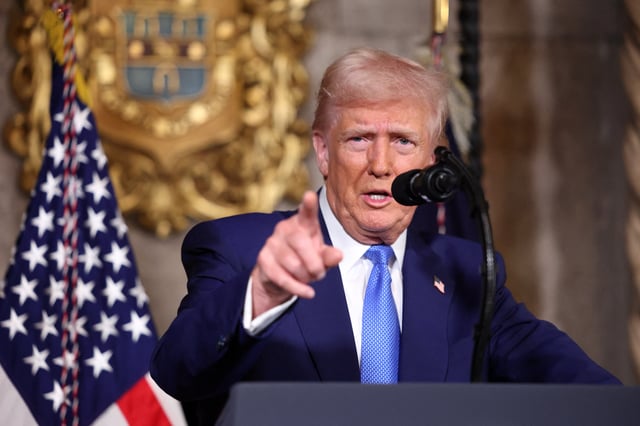 U.S. President Donald Trump points as he speaks at Mar-a-Lago in Palm Beach, Florida, U.S., February 18, 2025. REUTERS/Kevin Lamarque