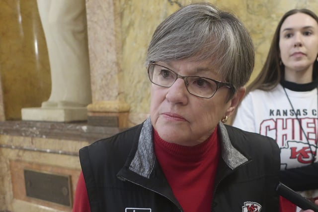 Kansas Gov. Laura Kelly speaks to reporters following a public event, Friday, Feb. 7, 2025, at the Statehouse in Topeka, Kansas. She has vetoed a bill that would ban gender-affirming care for transgender minors. (AP Photo/John Hanna)