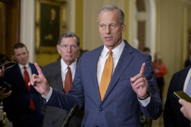 Sen. John Barrasso, R-Wyo., left, listens while Senate Majority Leader John Thune, R-S.D., speaks following the Senate Republican policy luncheon at the Capitol, Tuesday, Feb. 4, 2025, in Washington. (AP Photo/Rod Lamkey, Jr.)