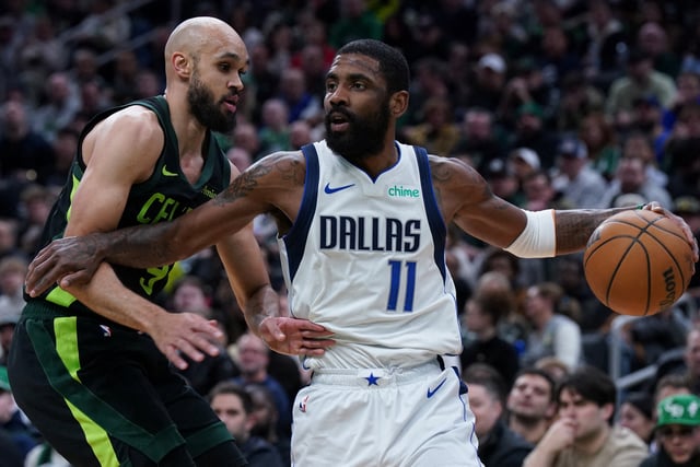 Feb 6, 2025; Boston, Massachusetts, USA; Dallas Mavericks guard Kyrie Irving (11) drives the ball against Boston Celtics guard Derrick White (9) in the first quarter at TD Garden. Mandatory Credit: David Butler II-Imagn Images/File Photo