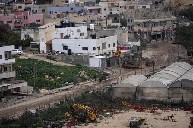 Israeli soldiers are seen operating inside the Far'a refugee camp, near the West Bank city of Tubas, Tuesday, Feb. 11, 2025. (AP Photo/Nasser Nasser)