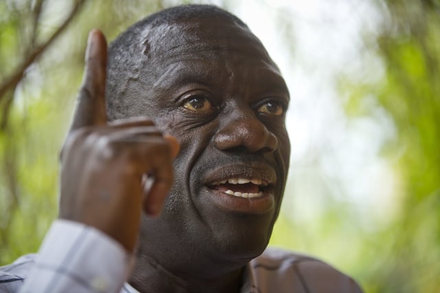 FILE - Opposition politician and then-presidential candidate Kizza Besigye speaks to the media while under house arrest at his home in Kasangati, outside the capital Kampala, in Uganda, Feb. 21, 2016. (AP Photo/Ben Curtis, File)