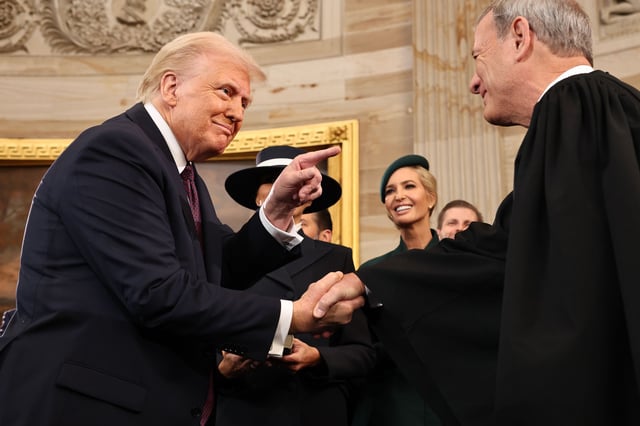 U.S. President Donald Trump gestures to U.S. Supreme Court Chief Justice John Roberts after he was sworn in during inauguration ceremonies in the Rotunda of the U.S. Capitol on January 20, 2025 in Washington, DC.