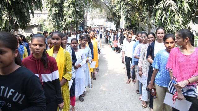 Patna: Students in queue before appearing in the Class 10th exam of the Bihar School Examination Board (BSEB) at DAV high school Danapur in Patna.