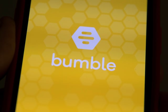 The Bumble Inc. (BMBL) app is shown on an Apple iPhone in this photo illustration as the dating app operator made its debut IPO on the Nasdaq stock exchange February 11, 2021. REUTERS/Mike Blake/Illustration/File Photo