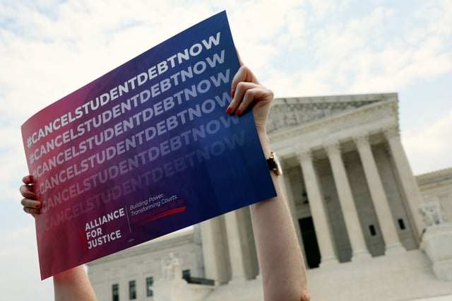 A file photo shows a student debt relief activist at a rally at the U.S. Supreme Court on June 30, 2023 in Washington, D.C.
