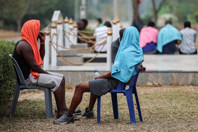 Multinational victims of scam centres, who were trafficked into working in Myanmar and were sent to Thailand on February 12 amid a mounting crackdown on scam centres operating along a porous border, wait for their embassies to pick them up at a shelter inside the 310th Military District (Fort Wachiraprakan), in Tak province, Thailand February 19, 2025. REUTERS/Chalinee Thirasupa