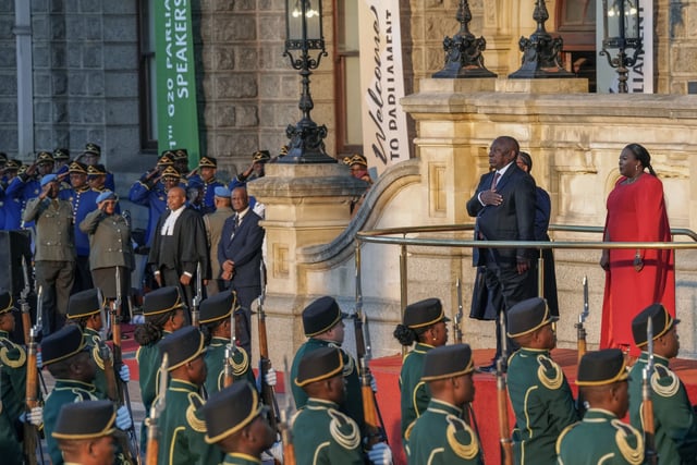 South African President Cyril Ramaphosa gestures for the national anthem from the steps of Cape Town's city hall before delivering his annual state of the union address, Thursday, Feb. 6, 2025. (AP Photo/Nardus Engelbrecht)