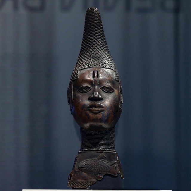 (FILES) In this file picture a sculpture with the title 'uhunmwun elao - memorial head of a queen mother' is on display next to other 'Benin Bronzes' during a press preview of the new exhibition halls ahead of their opening at the new Berlin Palace Humboldt Forum in Berlin on September 15, 2022. In December, Germany returned 22 priceless artefacts looted during the colonial era to what is now Nigeria. But five months on, questions are being asked in Germany about the wisdom of the move. (Photo by JENS SCHLUETER / AFP) (Photo by JENS SCHLUETER/AFP via Getty Images)