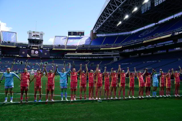 Jun 16, 2024; Seattle, Washington, USA; Portland Thorns FC players salute their traveling fans after the game against Seattle Reign FC at Lumen Field. Mandatory Credit: Stephen Brashear-USA TODAY Sports/File Photo