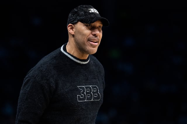 LaVar Ball looks on during the game between the Charlotte Hornets and the Brooklyn Nets at Spectrum Center on March 08, 2022 in Charlotte, North Carolina. NOTE TO USER: User expressly acknowledges and agrees that, by downloading and or using this photograph, User is consenting to the terms and conditions of the Getty Images License Agreement.