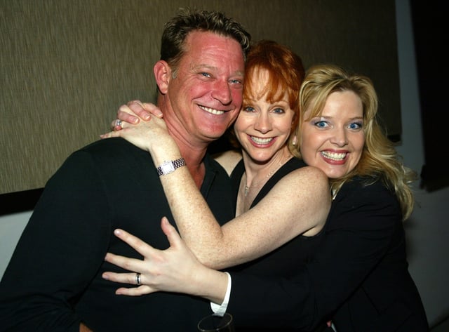 Christopher Rich, Reba McEntire and Melissa Peterman attend the WB 2003 Winter TCA Tour Party at Hollywood and Highland in Los Angele on Jan. 11, 2003.