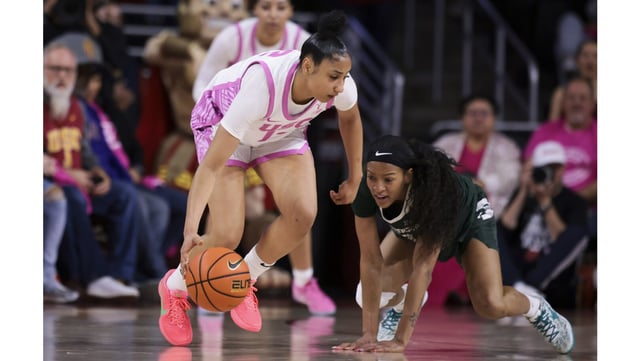 USC guard JuJu Watkins handles the ball as Michigan State guard Jocelyn Tate defends during the first half of their Big Ten game on Wednesday night at the Galen Center. (AP Photo/Jessie Alcheh)