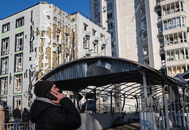 A resident stands at the site of an apartment building and a clinic hit by a Russian drone strike, amid Russia's attack on Ukraine, in Odesa, Ukraine February 19, 2025. REUTERS/Nina Liashonok/File Photo