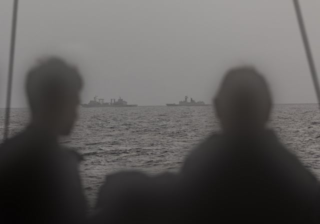 In this photo provided by the Australian Defense Department on February 20, 2025, Royal Australian Navy sailors assigned to frigate HMAS Arunta monitor Chinese replenishment vessel CNS Weishanhu, left, and frigate CNS Hengyang, right, in the Tasman Sea.