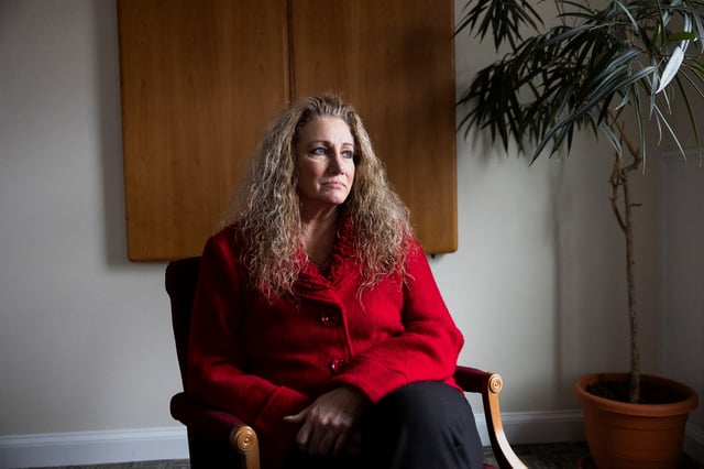 Marlean Ames sits for a portrait at the law office of Edward Gilbert, her lawyer, in Akron, Ohio, U.S., February 13, 2025. REUTERS/Megan Jelinger