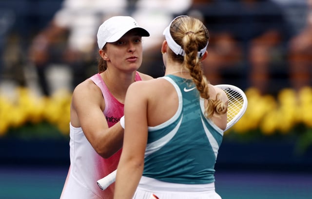 Tennis - Dubai Championships - Dubai Tennis Stadium, Dubai, United Arab Emirates - February 20, 2025 Russia's Mirra Andreeva shakes hands with Poland's Iga Swiatek after winning her quarter final match REUTERS/Amr Alfiky