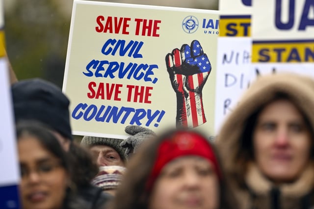 People rally at Health and Human Services headquarters to protest the polices of President Donald Trump and Elon Musk Wednesday, Feb. 19, 2025, in Washington. (AP Photo/John McDonnell)