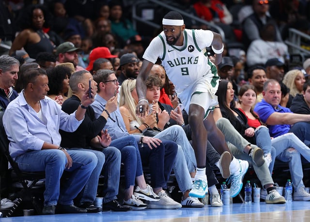 Bobby Portis Jr. #9 of the Milwaukee Bucks reacts after hitting a three-point basket against the Atlanta Hawks during the third quarter at State Farm Arena on March 30, 2024, in Atlanta, Georgia.