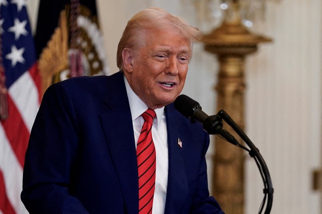 U.S. President Donald Trump speaks during a reception honouring Black History Month in the East Room of the White House in Washington, D.C., U.S., February 20, 2025. REUTERS/Kent Nishimura