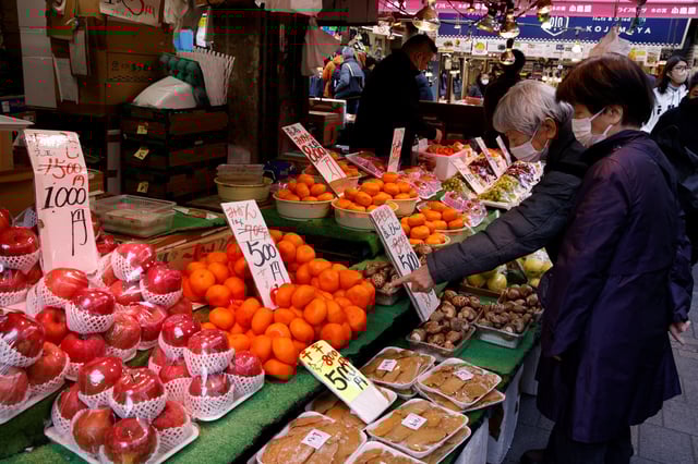 People shop daily necessities at a market in Tokyo, Japan March 3, 2023. REUTERS/Androniki Christodoulou/File Photo