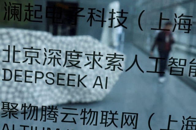 A DeepSeek AI sign is seen at a building where the Chinese start-up's office is located in Beijing, China, February 19, 2025. REUTERS/Florence Lo/File Photo