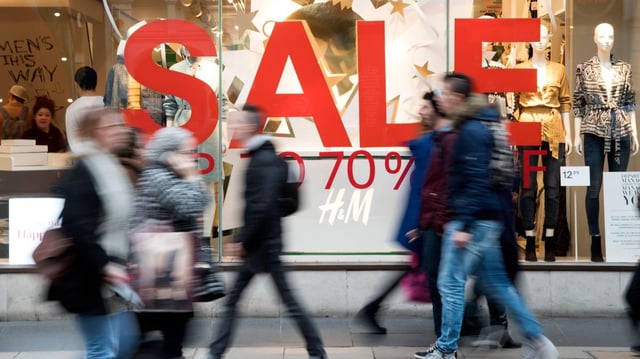 Shoppers spent more at supermarkets and specialist food shops in January but they avoided clothing retailers