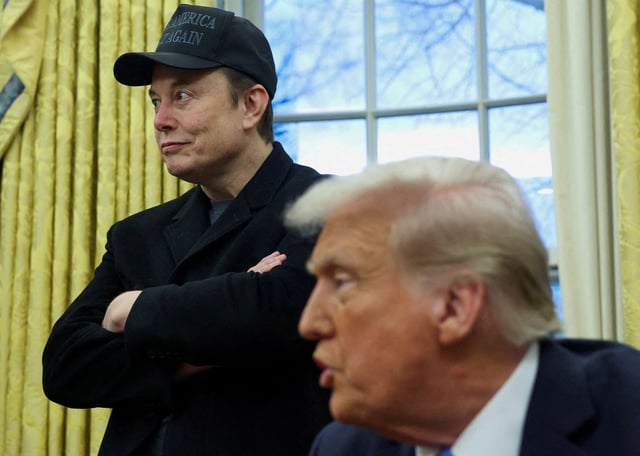 Elon Musk listens to U.S. President Donald Trump speak in the Oval Office of the White House in Washington, D.C., U.S., February 11, 2025. REUTERS/Kevin Lamarque/File Photo