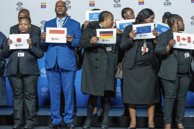 Placeholders prepare for the family photo of the G20 foreign ministers meeting that was later cancelled in Johannesburg, South Africa, Thursday, Feb. 20, 2025. (AP Photo/Jerome Delay)