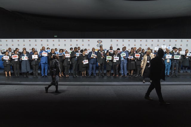 Placeholders prepare for a family photo of the G20 foreign ministers meeting that was later cancelled in Johannesburg, South Africa, Thursday, Feb. 20, 2025. (AP Photo/Jerome Delay)