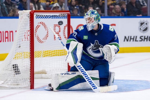 Feb 8, 2025; Vancouver, British Columbia, CAN; Vancouver Canucks goalie Kevin Lankinen (32) watches the flying puck against the Toronto Maple Leafs in the third period at Rogers Arena. Mandatory Credit: Bob Frid-Imagn Images/File Photo