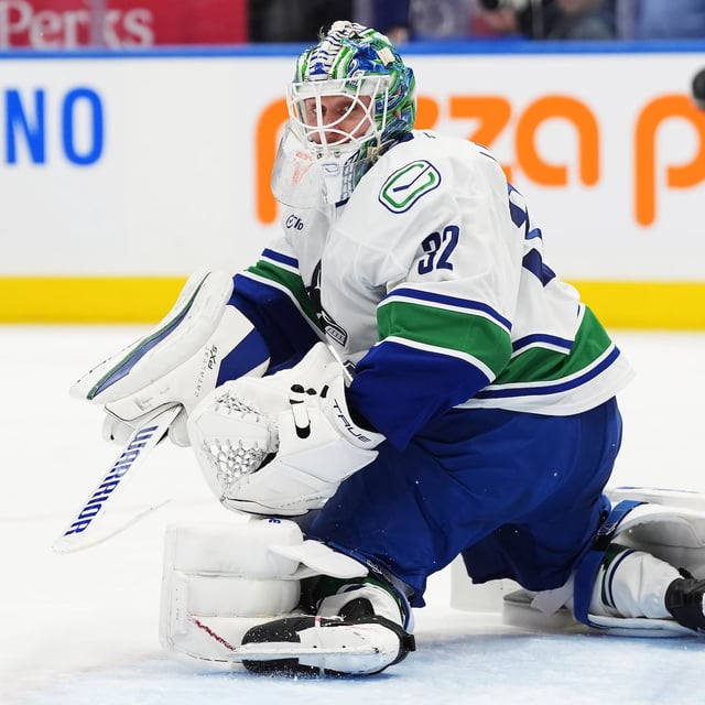 Vancouver Canucks goaltender Kevin Lankinen (32) makes a save against the Toronto Maple Leafs during second period NHL hockey action in Toronto on Saturday, January 11, 2025.The Canucks have signed Lankinen to a five-year contract extension with an average annual value of US$4.5 million, the club announced Friday. THE CANADIAN PRESS/Frank Gunn