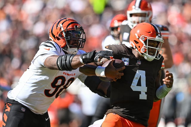 CLEVELAND, OHIO - OCTOBER 20: Sheldon Rankins #98 of the Cincinnati Bengals sacks Deshaun Watson #4 of the Cleveland Browns in the second quarter of a game at Huntington Bank Field on October 20, 2024 in Cleveland, Ohio.